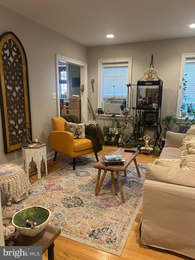 living room with hardwood / wood-style flooring and cooling unit