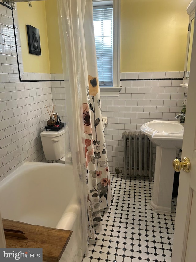 bathroom featuring tile walls, tile patterned flooring, radiator heating unit, and shower / bath combination with curtain