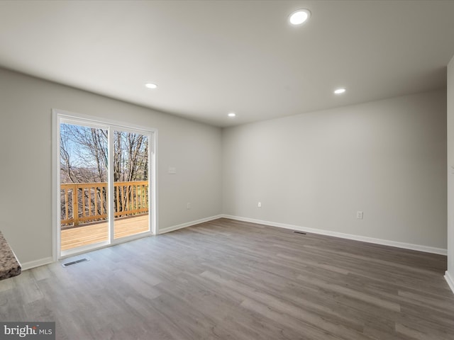 unfurnished room featuring wood-type flooring