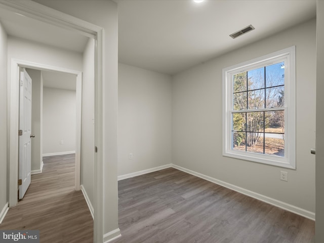 unfurnished room featuring wood-type flooring