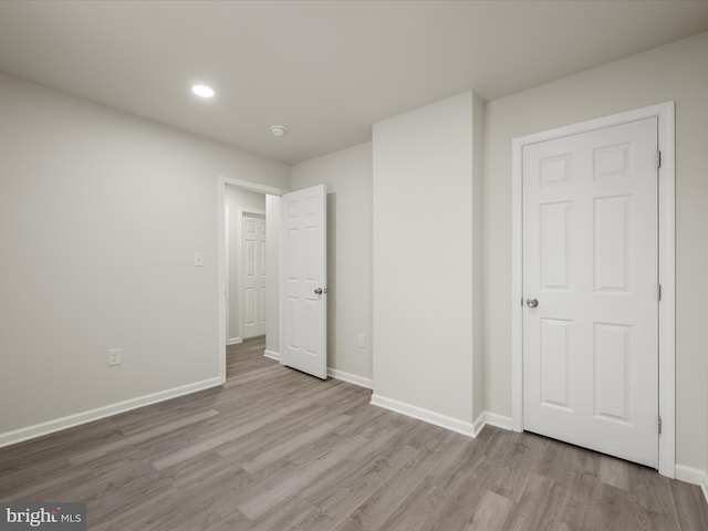 unfurnished bedroom with light hardwood / wood-style flooring