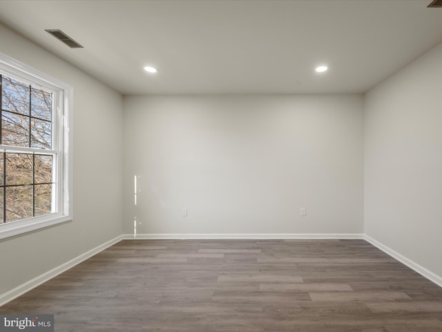 spare room with wood-type flooring