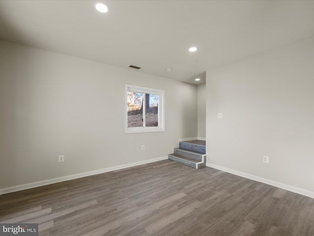 spare room with hardwood / wood-style flooring