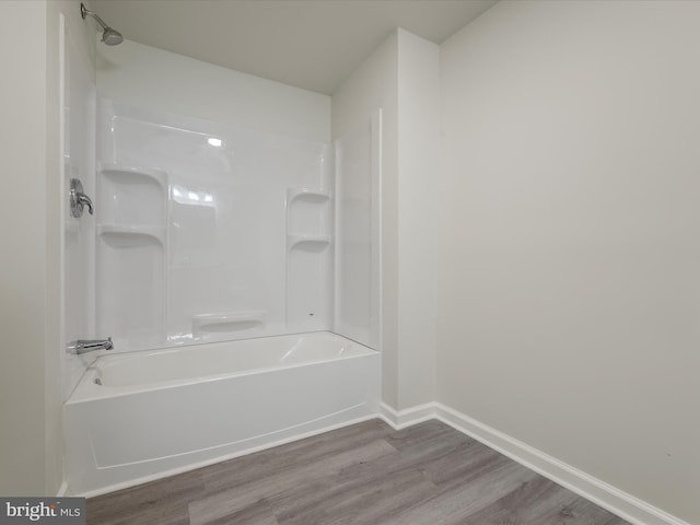 bathroom featuring tub / shower combination and hardwood / wood-style floors