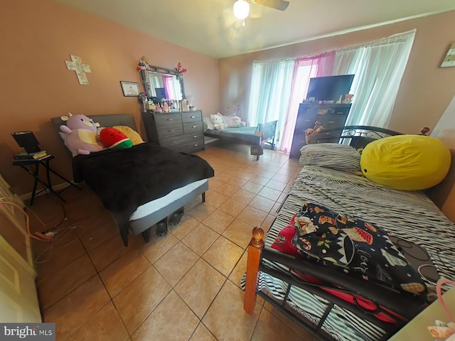 tiled bedroom with ceiling fan