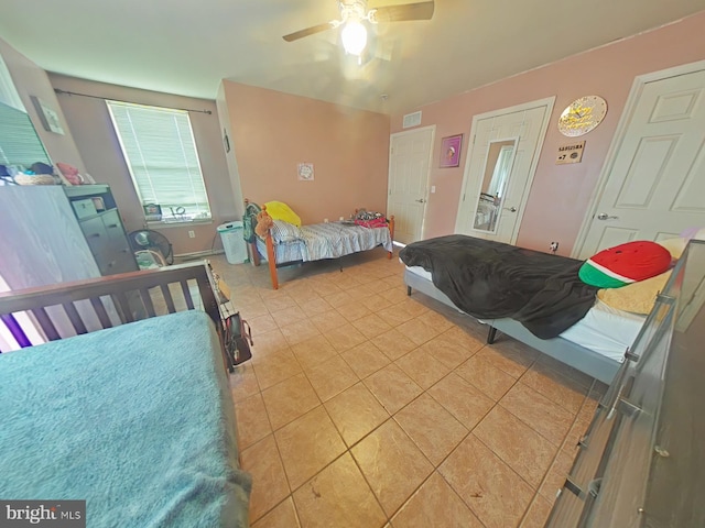 bedroom featuring ceiling fan and light tile patterned floors