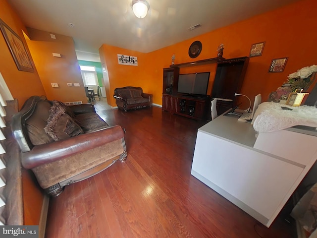 living room with dark hardwood / wood-style flooring