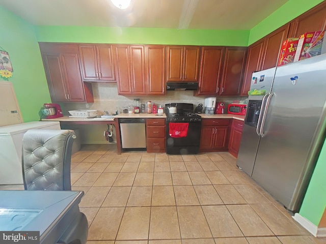 kitchen with light tile patterned floors, backsplash, and appliances with stainless steel finishes