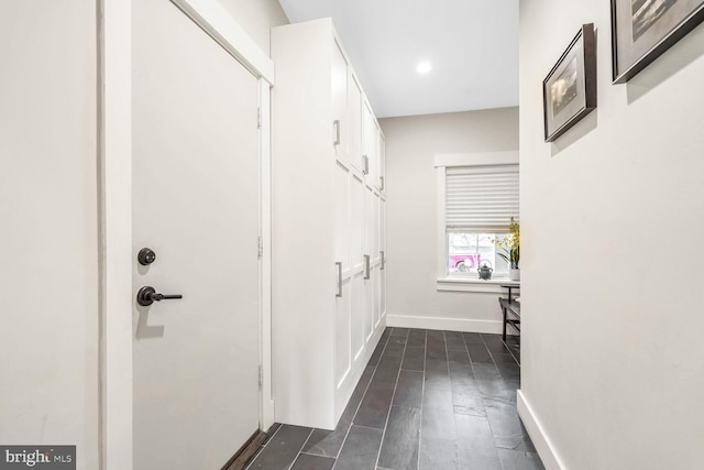 hallway featuring dark hardwood / wood-style floors