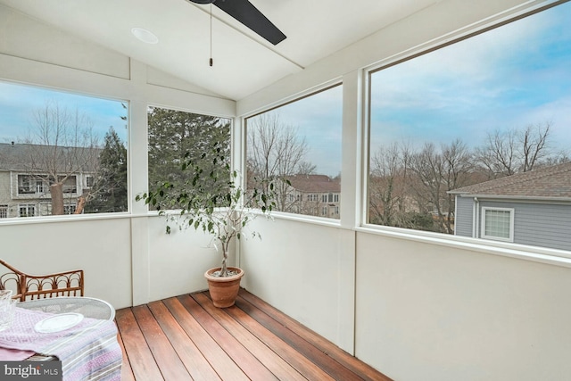 unfurnished sunroom featuring ceiling fan and lofted ceiling