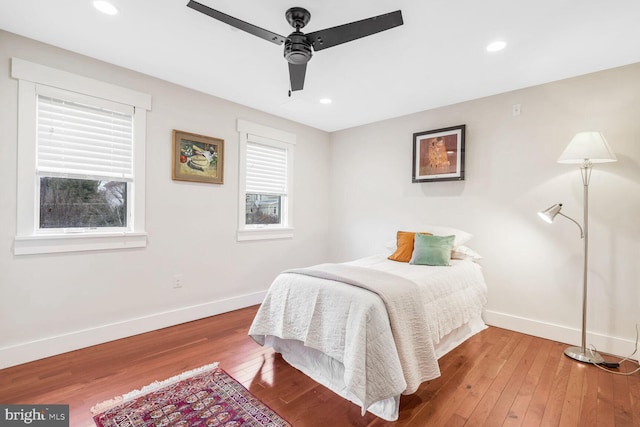 bedroom with hardwood / wood-style floors and ceiling fan