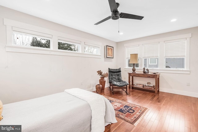 bedroom featuring wood-type flooring and ceiling fan