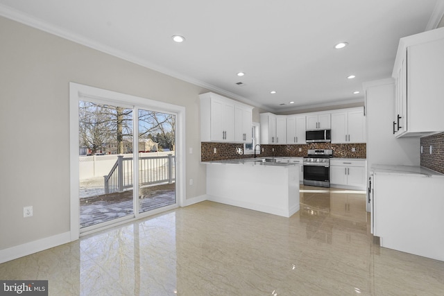 kitchen featuring appliances with stainless steel finishes, crown molding, white cabinets, and sink