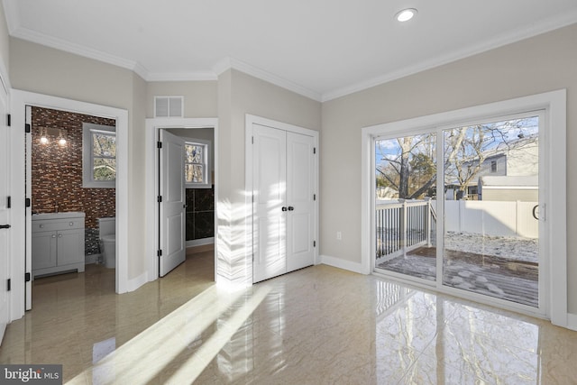 entrance foyer featuring ornamental molding