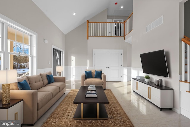 living room featuring high vaulted ceiling