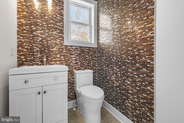 bathroom featuring toilet and vanity