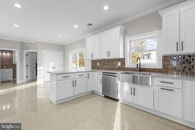 kitchen with sink, white cabinets, and dishwasher