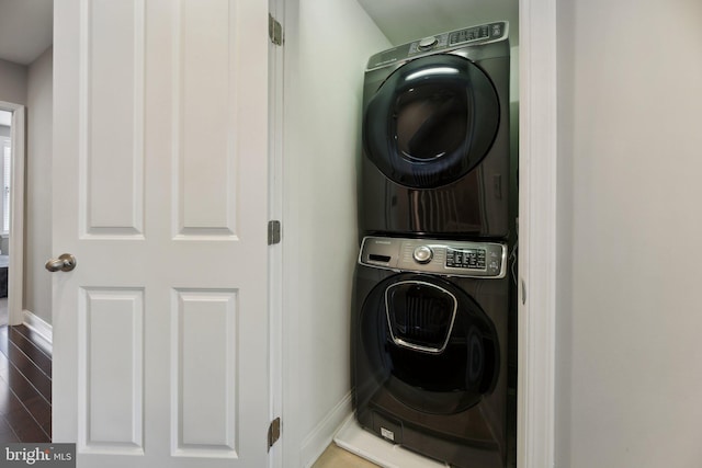 laundry room with stacked washer / drying machine