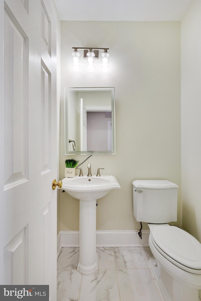 bathroom with sink and toilet