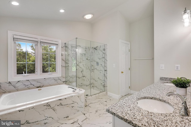 bathroom with lofted ceiling, vanity, and independent shower and bath