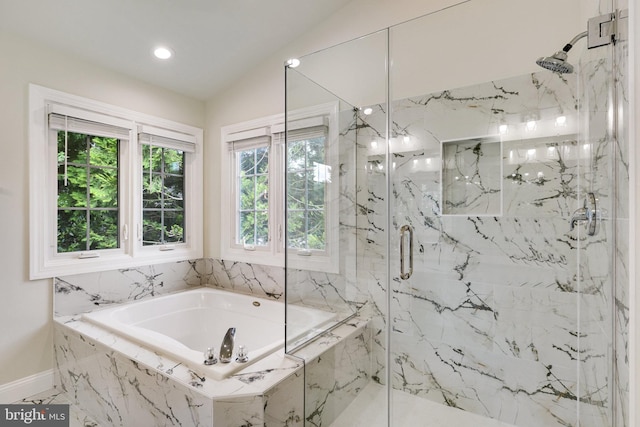 bathroom with lofted ceiling and independent shower and bath