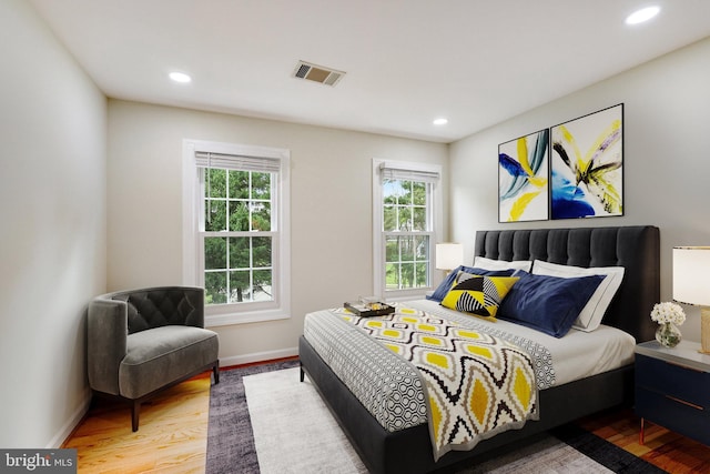 bedroom with wood-type flooring