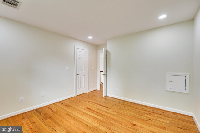 spare room featuring light hardwood / wood-style flooring