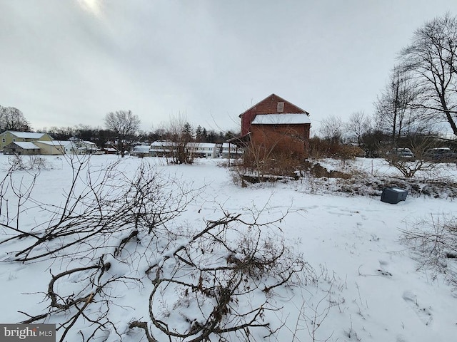 view of yard layered in snow