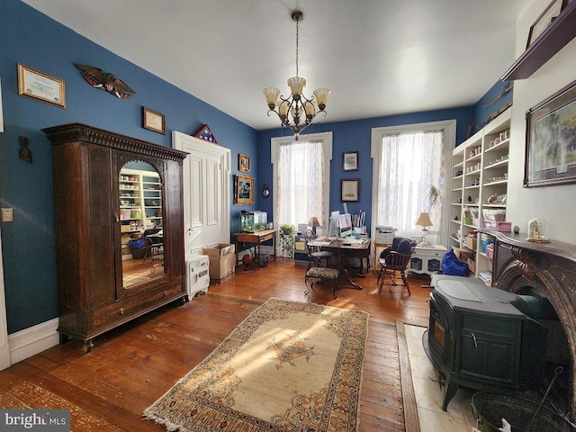 office space with a chandelier and dark hardwood / wood-style floors