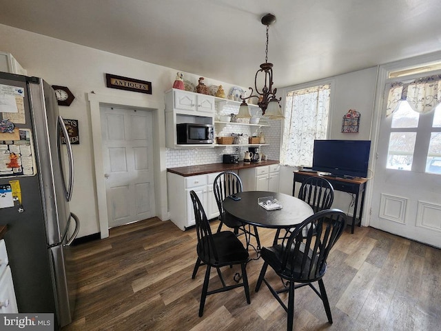 dining room featuring dark hardwood / wood-style flooring