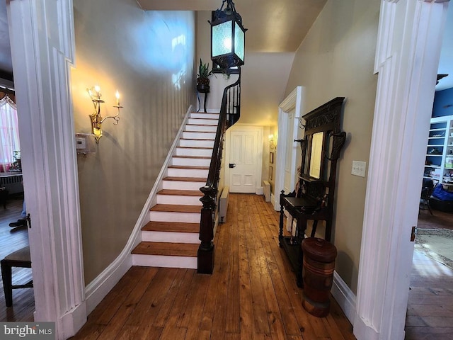 stairway featuring hardwood / wood-style floors