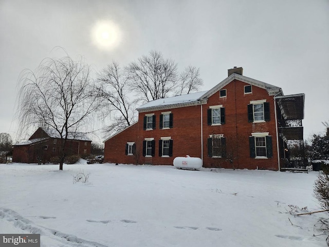 view of snow covered house