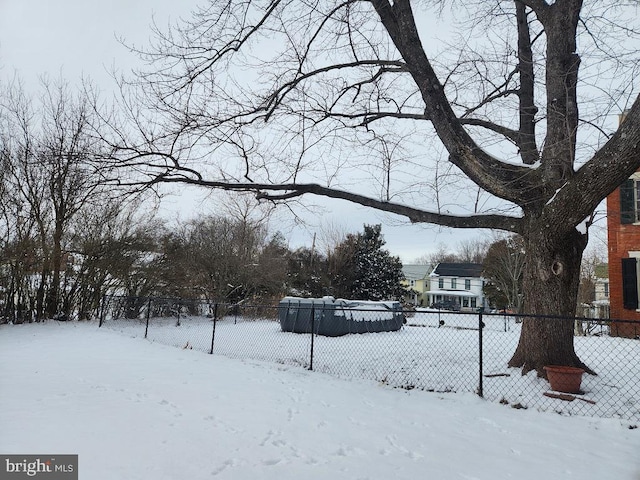 view of yard layered in snow