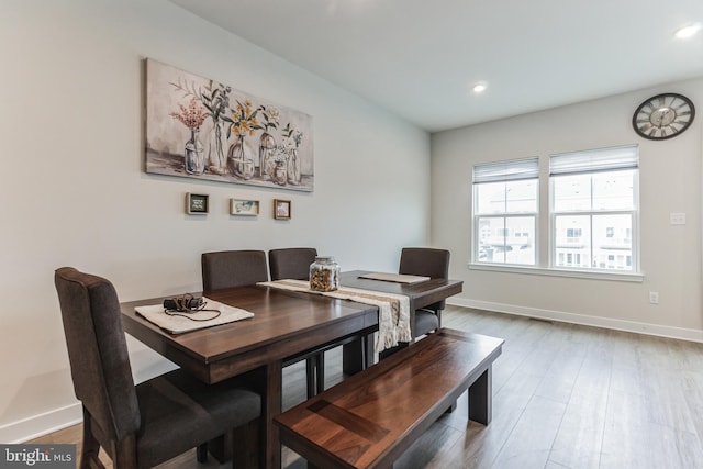 dining room with hardwood / wood-style flooring