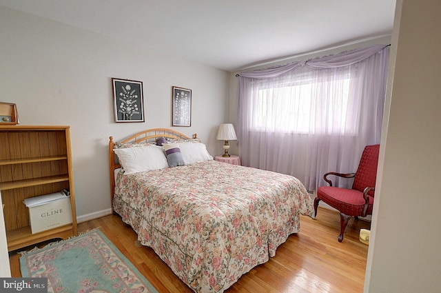 bedroom with hardwood / wood-style floors