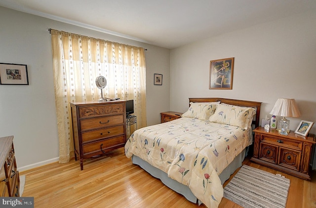 bedroom with light hardwood / wood-style floors