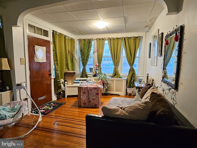 sitting room featuring wood-type flooring and a paneled ceiling