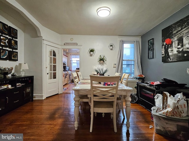 dining area featuring dark hardwood / wood-style floors