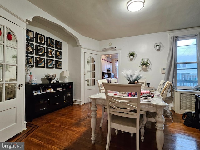 dining area with dark wood-type flooring