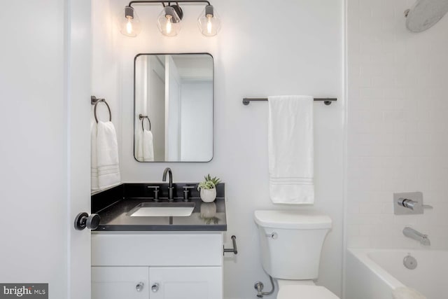 full bathroom featuring shower / bathtub combination, toilet, and vanity