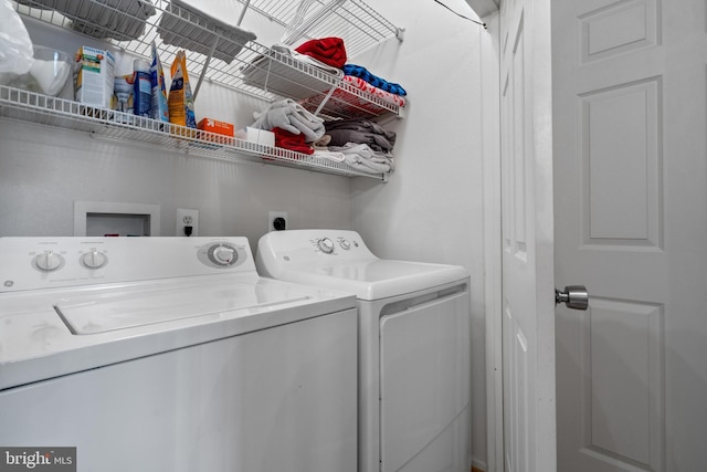 washroom with washer and dryer