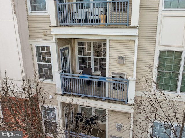 entrance to property with a balcony