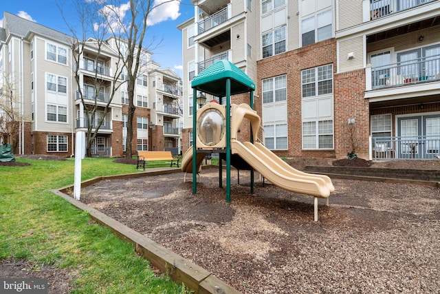 view of jungle gym with a lawn