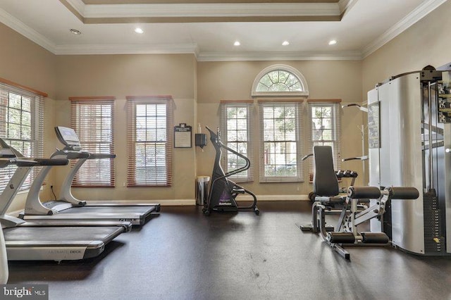 workout room featuring ornamental molding