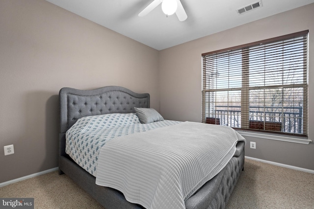 bedroom featuring light carpet and ceiling fan