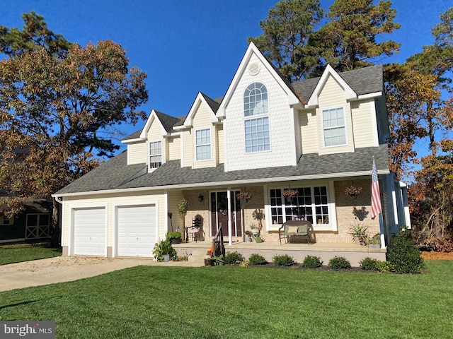 view of front of home featuring covered porch and a front yard