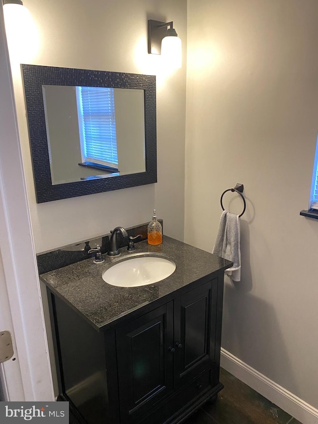 bathroom with wood-type flooring and vanity