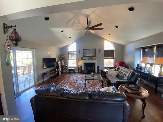 living room featuring hardwood / wood-style flooring, lofted ceiling, and ceiling fan