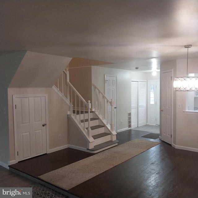 entrance foyer featuring dark hardwood / wood-style floors