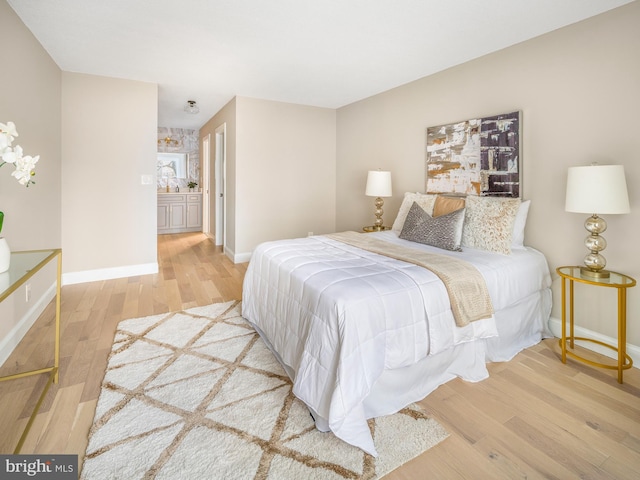 bedroom with wood-type flooring